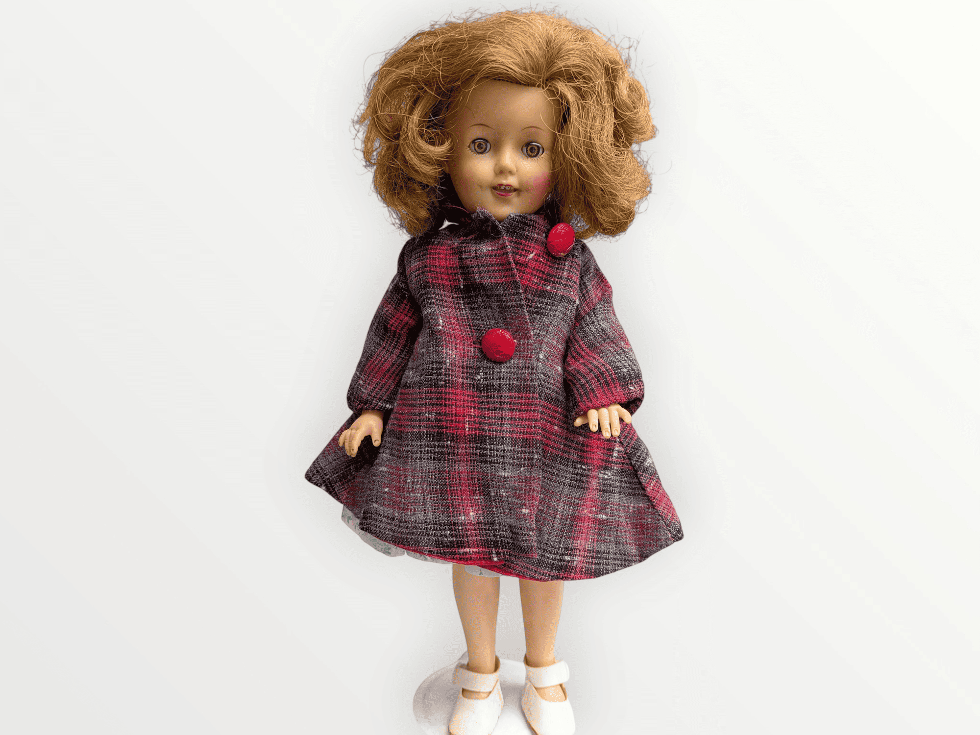Muñeca vintage Shirley Temple de 28 cm de Ideal Toy Corp con abrigo a cuadros rojo y gris.