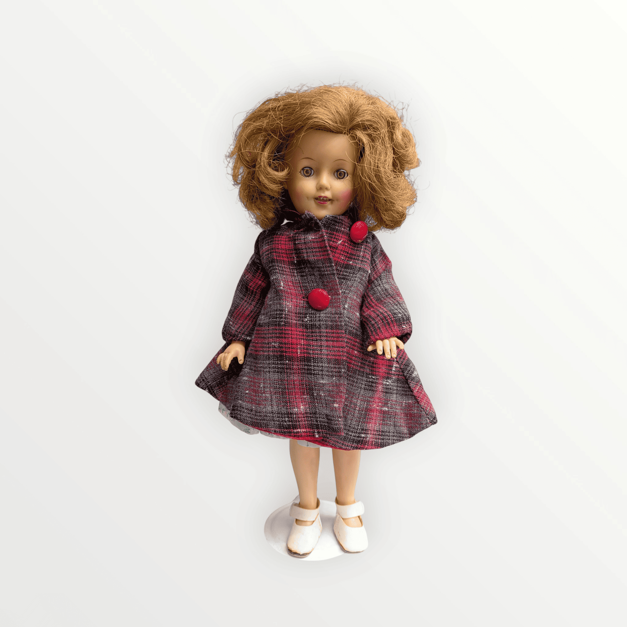 Mu&ntilde;eca vintage Shirley Temple de 28 cm de Ideal Toy Corp con abrigo a cuadros rojo y gris.